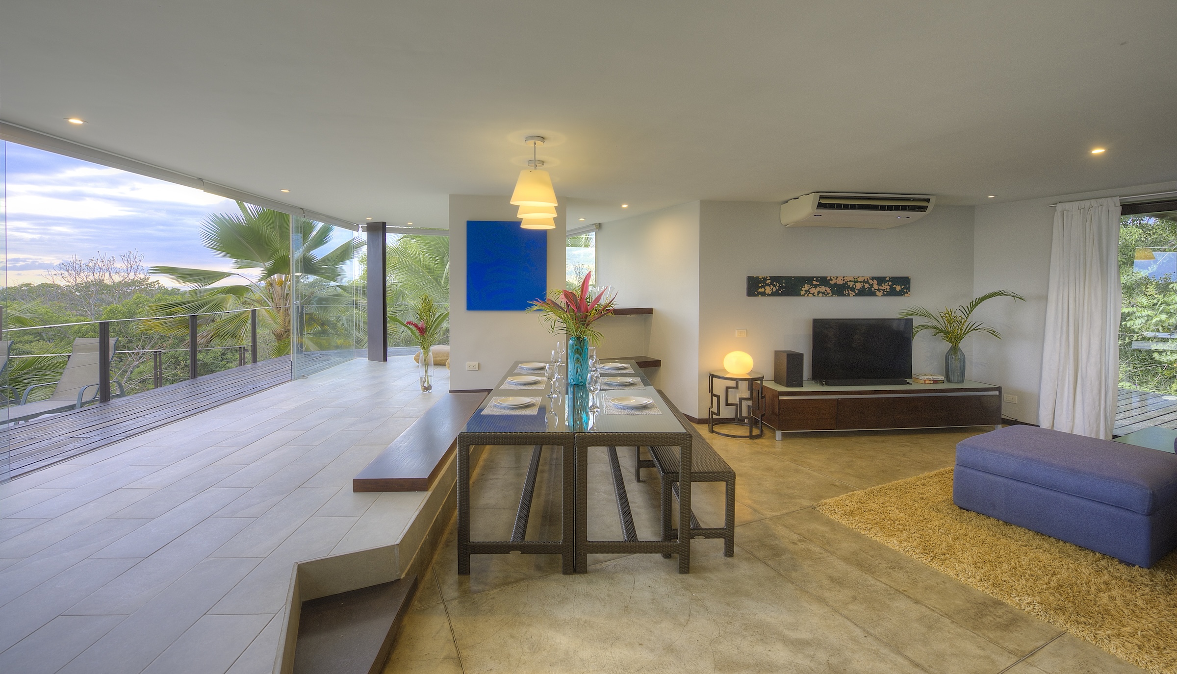 Open plan dining with panoramic jungle views