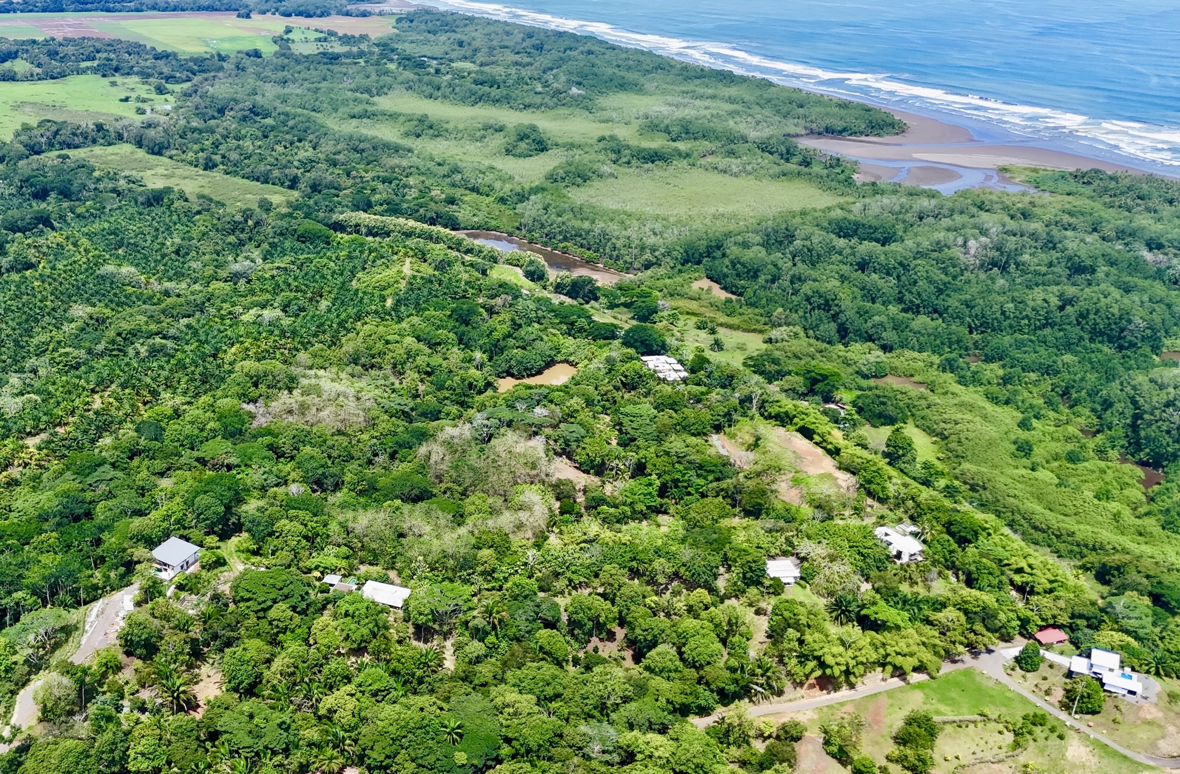 Aerial view of Villa Los Laureles property showing lake, mangrove, beach and ocean - Playa Bejuco Costa Rica