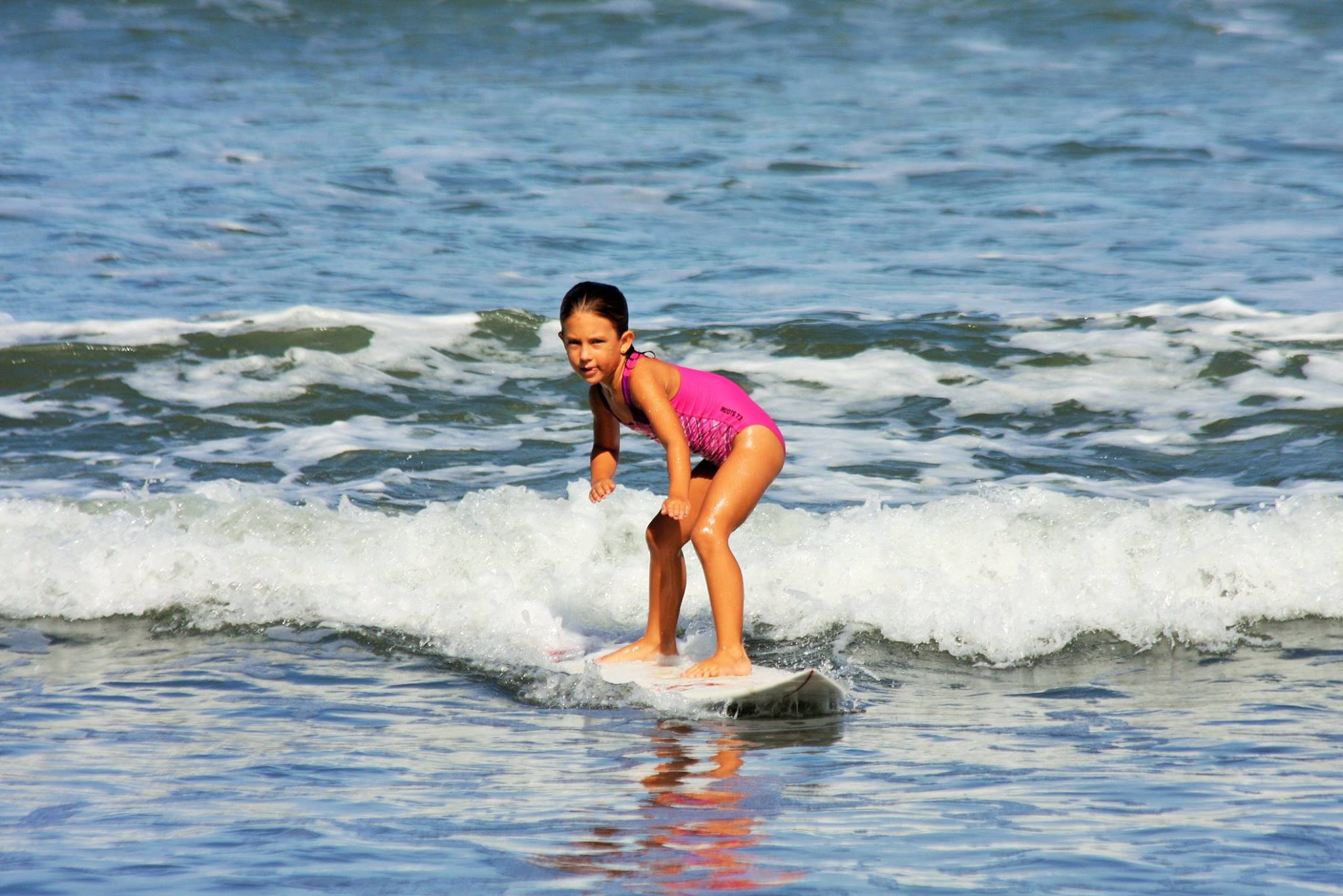 Young girl surfing Jaco Costa Rica