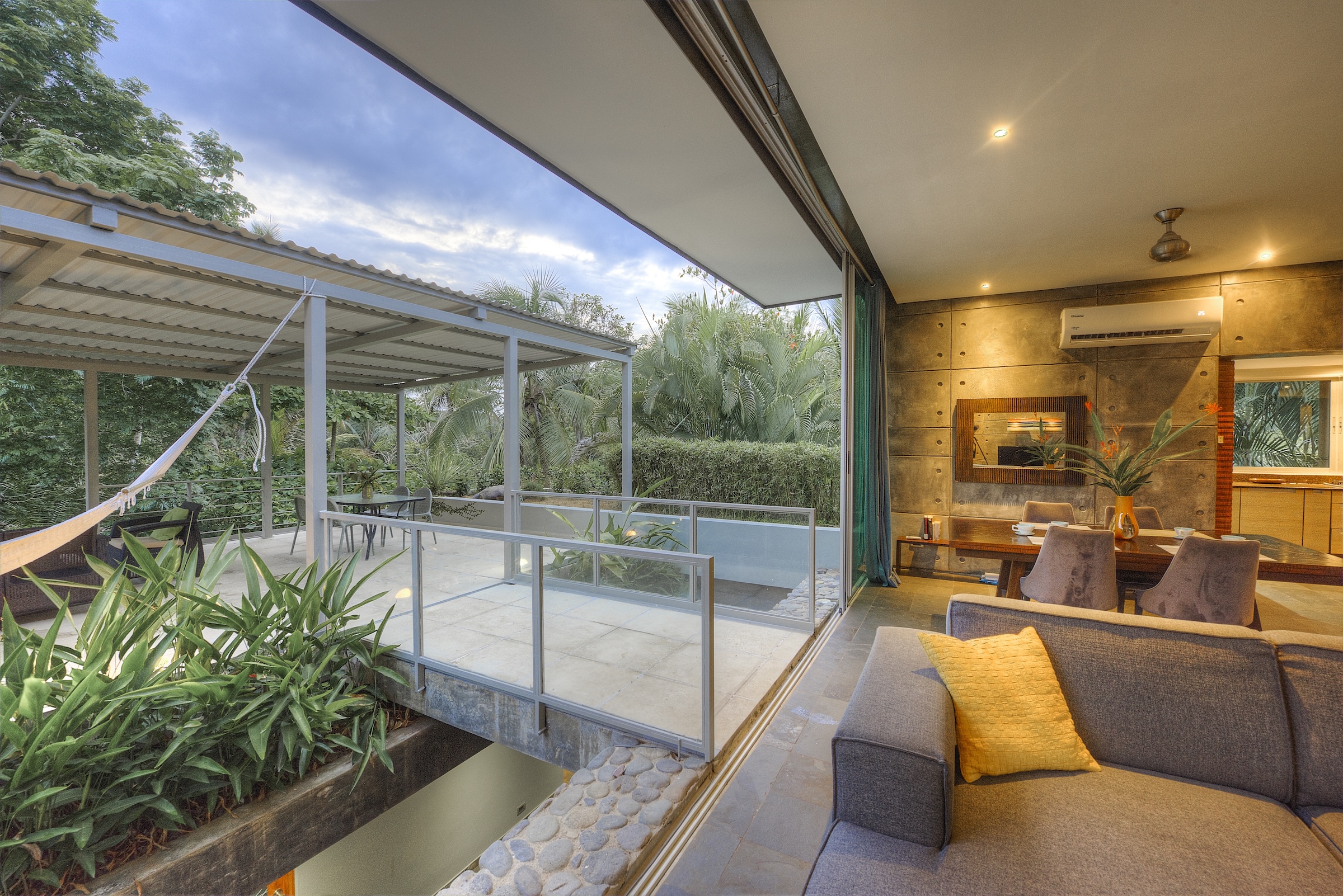 Covered deck and living area at dusk - Villa Los Laureles I